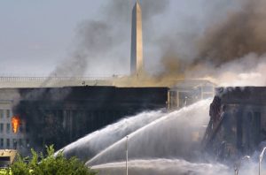 The Pentagon burns after a hijacked American Airlines flight crashed into it Sept. 11, 2001. (Reuters/Hyungwon Kang) 