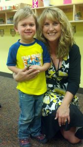 Noah and his lead teacher, Ms. Gina, on his last day of preschool, May 23, 2013. Photo by Kristina Cowan.